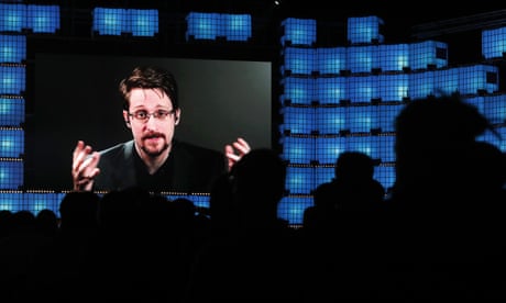 FILE - In this Nov. 4, 2019, file photo, former U.S. National Security Agency contractor Edward Snowden addresses attendees through video link at the Web Summit technology conference in Lisbon. A judge has ruled on Tuesday, Dec. 17, 2019, that Snowden violated secrecy agreements with the U.S. government that allow it to claim proceeds from a memoir he published. Federal Judge Liam O’Grady ruled that Snowden is liable for breach of contract with the government because he published “Permanent Record,” without submitting it for a pre-publication review. (AP Photo/Armando Franca, File)