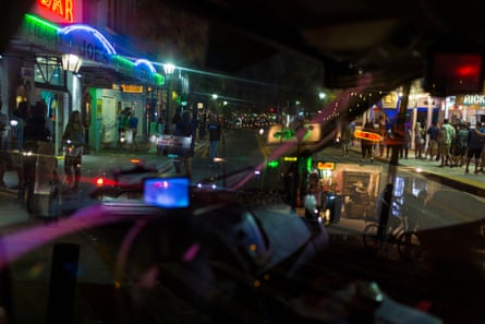 View from inside a local authority vehicle as Police shut down the access to automobile traffic on Duval Street to make more space for crowds to social distance.
