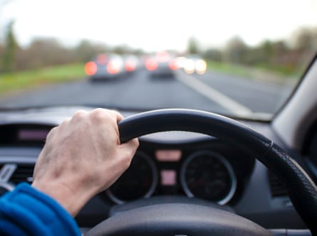 The driver's hand on the steering wheel
