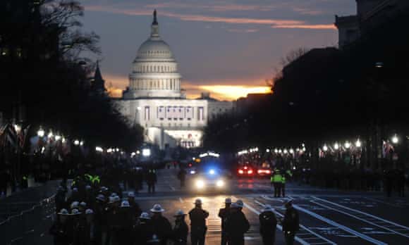 Security personnel gather on Pennsylvania Avenue before the presidential inauguration.
