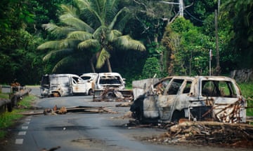 Burnt out cars are seen on the Plum Pass, an important traffic route through Monte-Dore in France's Pacific territory of New Caledonia on June 10, 2024