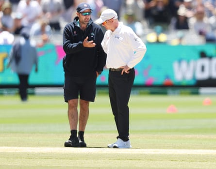 MCG Head Curator Matt Page (left) speaks to a match official during the second day of the fourth Ashes Test