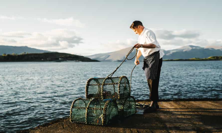 A fisherman with small round nets at Loch Linnhe