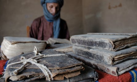 Fida Ag Mohamed in Timbuktu, with some of his family’s ancient manuscripts dating back to the 1300s.