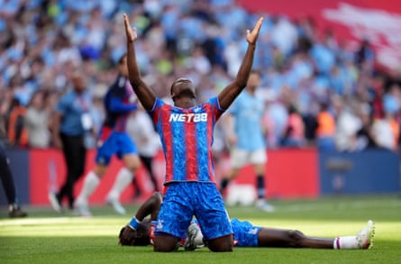 Marc Guéhi celebrates after Crystal Palace win the FA Cup final at Wembley.