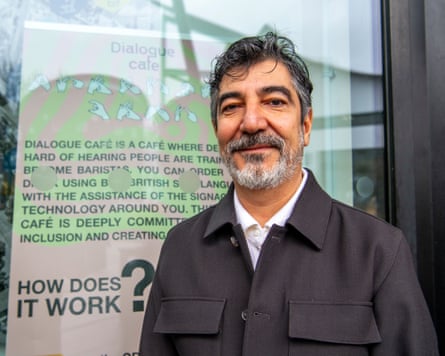 Hakan Elbir stands outside Dialogue Cafe.
