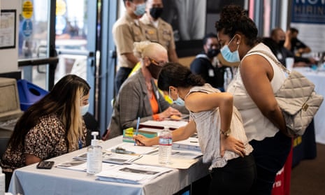 People speak with recruiters at a job fair in Los Angeles. 