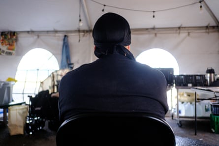 a man sits in a chair