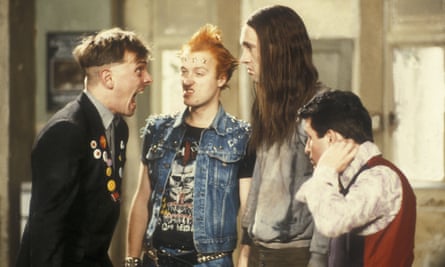 Rik Mayall shouting at the other three actors as part of a scene