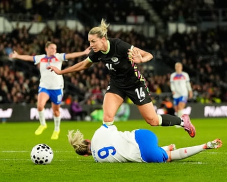 Alanna Kennedy thwarts Alessia Russo’s goalward charge – the Matildas midfielder was then shown a red card