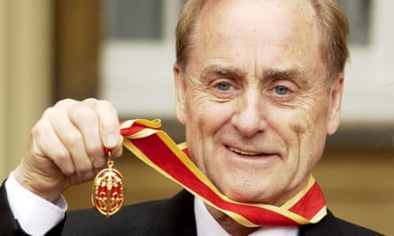 Sir Harold Evans receives his knighthood in 2004.
