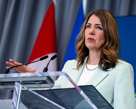 a woman speaks into a microphone