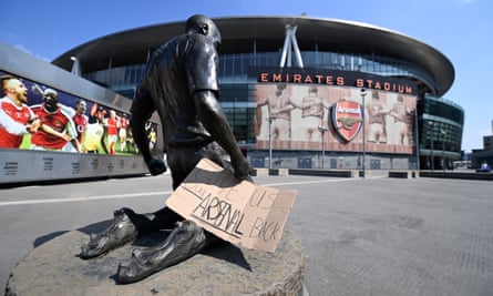 A sign saying 'Give Us Our Arsenal Back' outside Arsenal’s Emirates Stadium on Tuesday