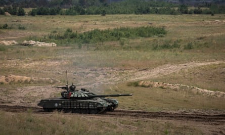 A tank moves towards enemy positions