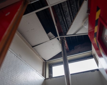 Broken and disjointed ceiling tiles in part of the fire station