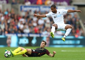 Manchester City’s John Stones slides in on Swansea’s Wayne Routledge as City maintain their perfect start to the season with a 3-1 away win at the Liberty. Manchester City are the only side to have scored the first goal in every one of their six Premier League games this season