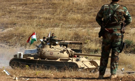 Iraqi Kurdish peshmerga fighters on the frontline east of Mosul on Sunday