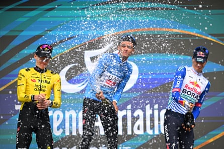 Tirreno-Adriatico victor Isaac del Toro sprays bubbly on the podium with Matteo Jorgenson and Giulio Pellizzari