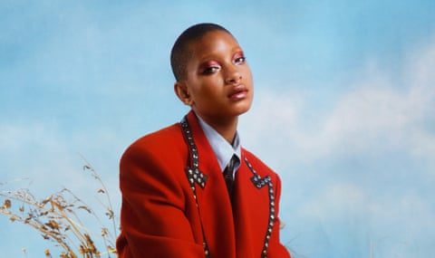 Willow Smith in red jacket and shirt and tie, August 2022