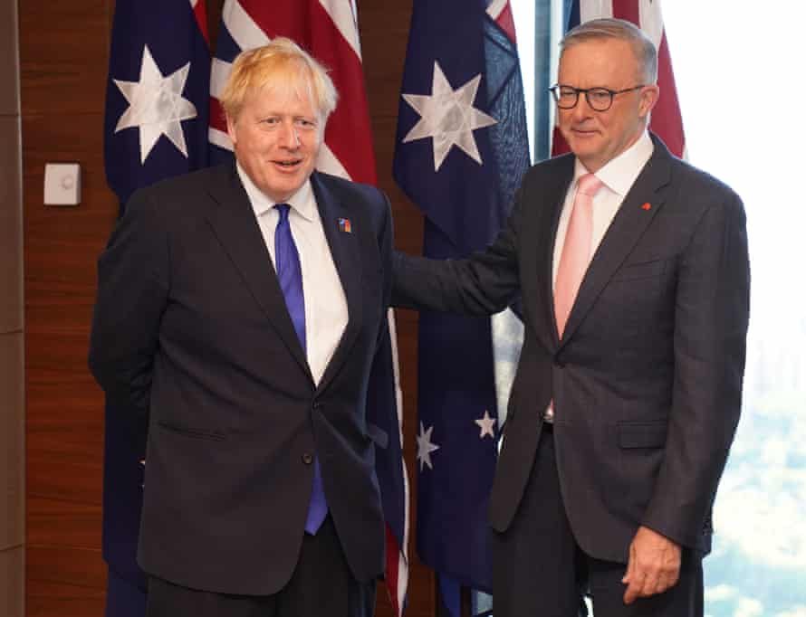 Boris Johnson with Anthony Albanese (right) at the Nato summit in Madrid today.
