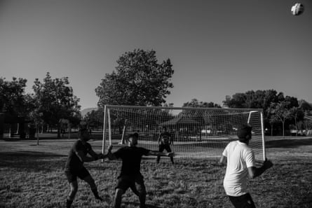 A group of men play soccer at Westwind Park in Ontario, California, where Black and Latino communities face some of the worst pollution in the state.