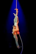 Members of circus company One Fell Swoop hang on a rope in By a Thread.