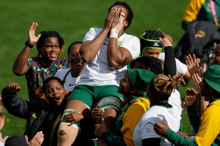 The South Africa 40-year-old captain, Nolusindiso Booi, is carried off the field by her team after the final whistle of their quarter-final defeat to New Zealand.