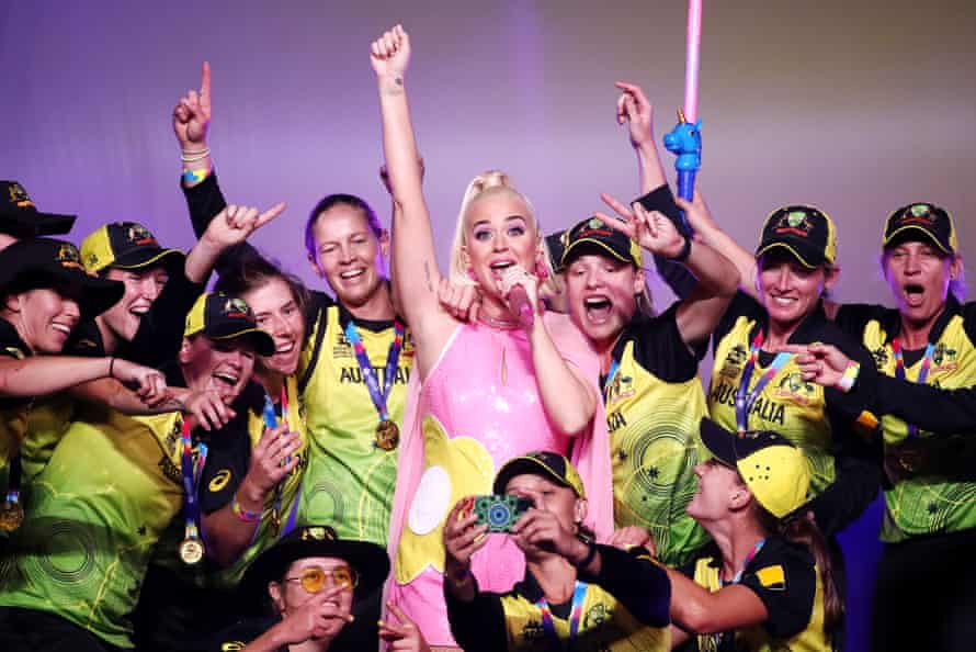 Katy Perry performs on stage with the Australian team during a concert after their victory in the ICC Women’s T20 Cricket World Cup Final match between India and Australia at the Melbourne Cricket Ground in March 2020.