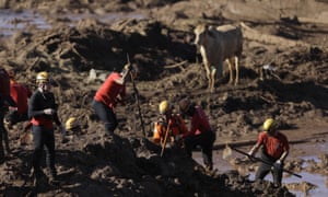 Firefighters look for victims of a dam collapse in Brumadinho, Brazil.