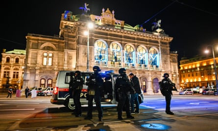 Heavily armed police stand outside the Vienna State Opera following shots fired in the city centre