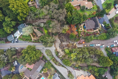 An aerial view of a washed away road in Santa Cruz during a storm.
