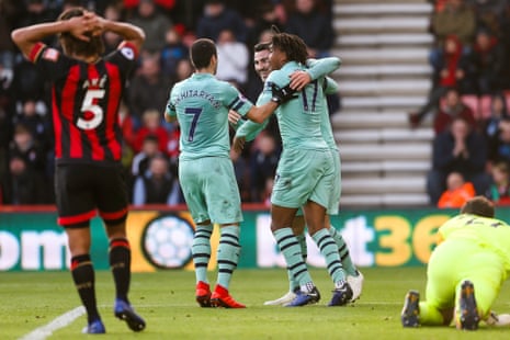 Henrikh Mkhitaryan, Alex Iwobi and Sead Kolasinac of Arsenal celebrate after Jefferson Lerma of Bournemouth scores an own goal.