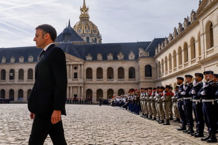 macron, in suit, in courtyard of historic building