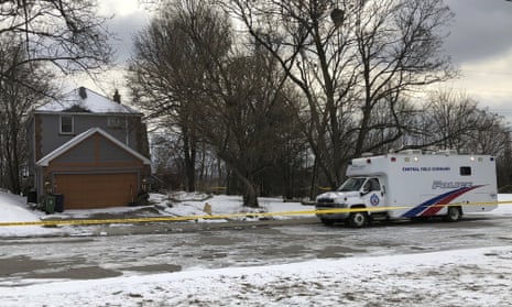 Crime scene tape surrounds a property on 3 February 2018, where police say they recovered the remains people from planters.