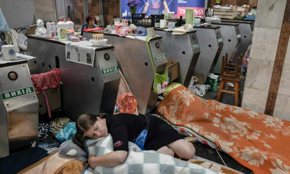 Natalia Tkachuk, 40, and her daughter Anastasia, 11, shelter from Russian shelling inside the Heroiv Pratsi underground station in the Kharkiv suburb of Saltivka.