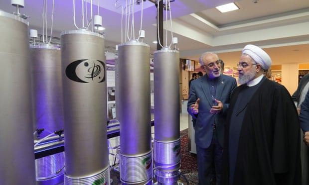 Iran’s President Rouhani inspects nuclear technology in Tehran. He says the country will exceed agreed enrichment levels ‘as much as is necessary’