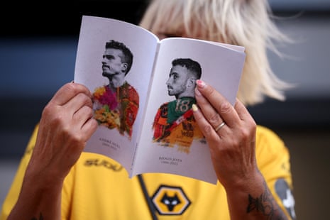 A Wolves fan reads today’s programme.