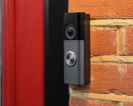 The Ring Wired Video Doorbell Pro 3 on an angled bracket fitted to a brick wall.