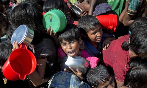 Rohingya Muslim children wait to receive food at Thaingkhali refugee camp in Ukhiya, Bangladesh.