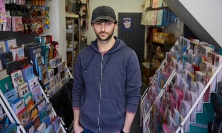 Man looks glum in card shop