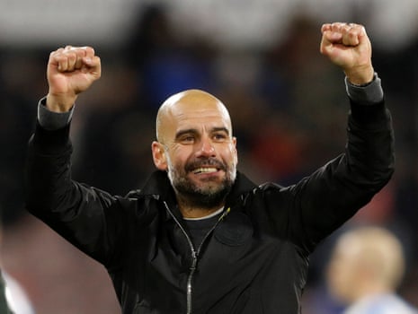 Guardiola celebrates after the final whistle.
