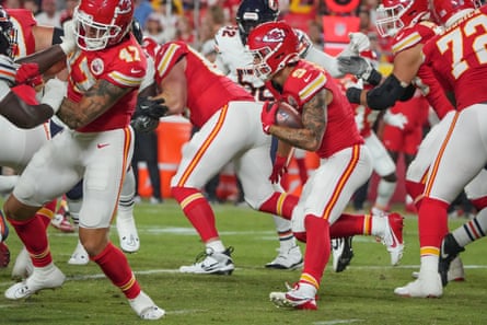 Kansas City Chiefs running back Louis Rees-Zammit runs the ball against the Chicago Bears during the second half of their August 2024 game.