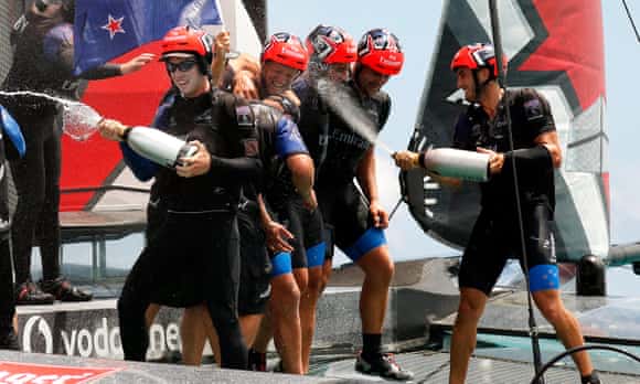 Emirates Team New Zealand including helmsman Pete Burling (left) celebrate after defeating Oracle Team USA during race nine in Bermuda and taking the America's Cup.