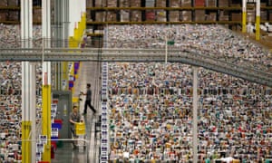 Workers gather items for delivery at Amazonâs distribution centre in Phoenix, Arizona. The US store, which sells about 500m items compared with 4m on the global store, will be blocked in Australia