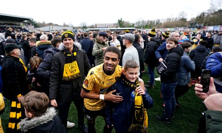 Maidstone's Liam Sole celebrates with fans after the third-round win against Stevenage.