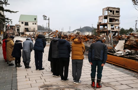 Residents in Wajima offer their prayers, a month after an earthquake killed more than 200 on Japan’s Noto peninsula.   