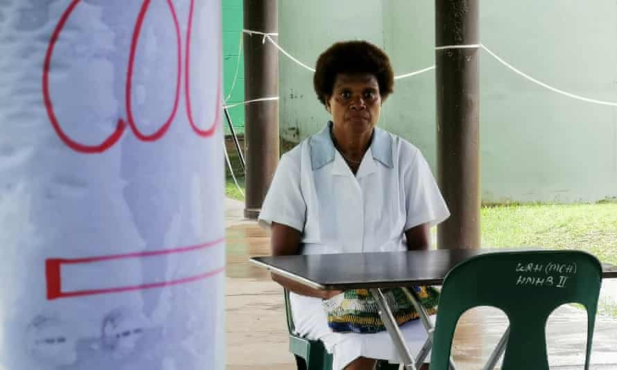 A nurse sits at a screening station at Warangoin Clinic in East New Britain Province in PNG.