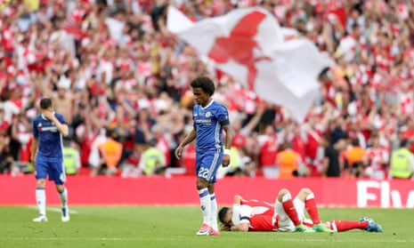 Chelsea’s Willian (centre) looks dejected after the final whistle