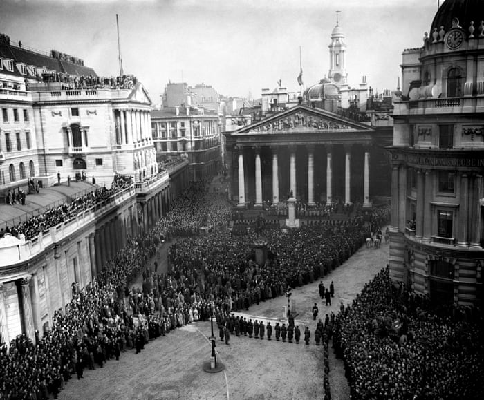 Huge crowds at the Royal Exchange in the City of London to hear the reading of the proclamation of accession of Queen Elizabeth II in February 1952.
