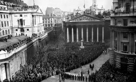 Crowds gather at the Royal Exchange to hear the reading of the proclamation of accession of Queen Elizabeth II in 1952.
